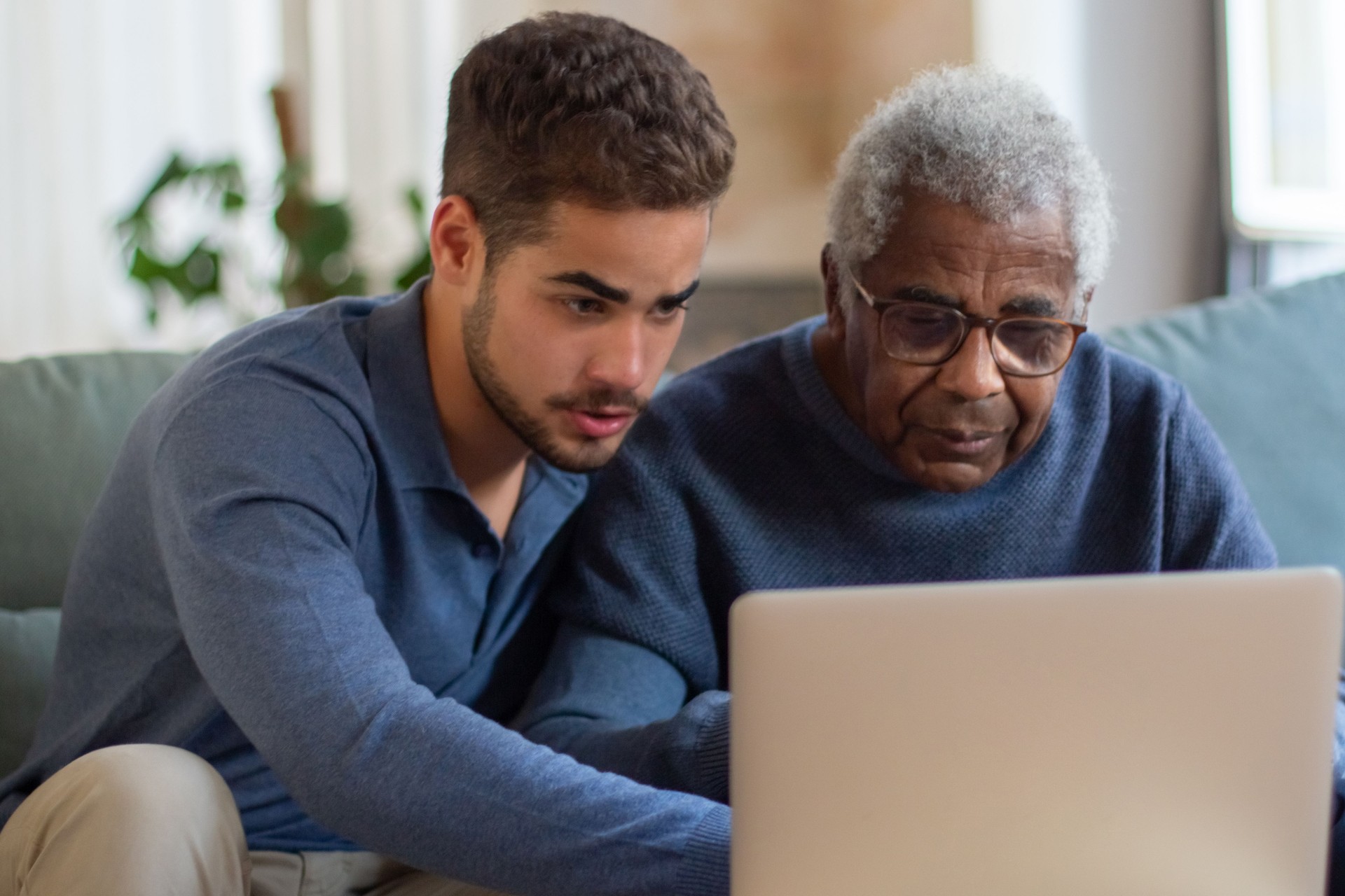 Portrait of aged man and his grandson enjoying time together